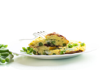 Egg omelette with herbs and vegetables isolated on white background