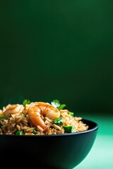 Delicious shrimp fried rice garnished with fresh herbs against v