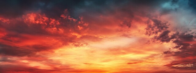 Fototapeta premium Vibrant Sunset Over Mountain Horizon with Dynamic Cloud Formation and Ample Space for Text Overlay