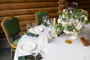 decorated round table with tablecloth in restaurant at banquet	