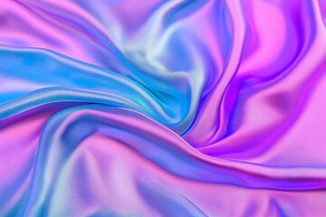 Obraz premium A vibrant close-up of shimmering satin fabric in vivid shades of purple, blue, and pink, showcasing silky textures and folds. .