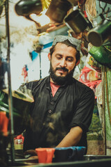 Pakistani Afghani Pathan preparing chai tea in his stall