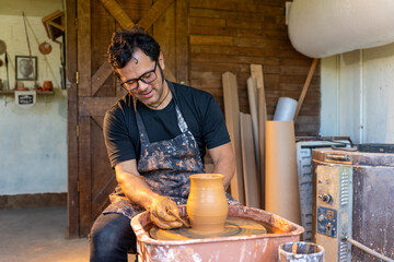 A Craftsman Skillfully Shaping Beautiful Clay Within a Dynamic Pottery Studio Environment