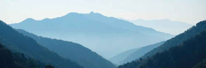Naklejka premium Misty Darjeeling peaks shrouded in grey clouds, nature, mountains, serene