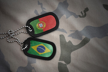 vintage army blank, dog tag with flag of portugal and brazil on the khaki texture background....