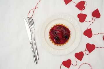  Delicious Berry Tart with Charming Romantic Heart Decorations for All Occasions on white bacground.