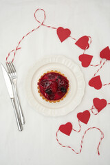  Delicious Berry Tart with Charming Romantic Heart Decorations for All Occasions on white bacground.