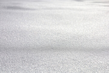 Close up of the fresh snow surface in bright light