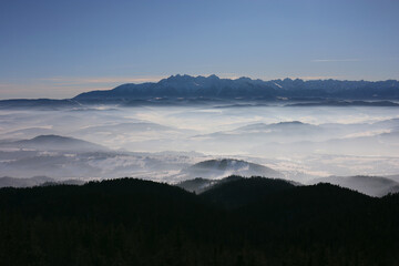 Scenic view of Tatra mountains and  from the top of Lubań mountain in Gorce, Poland. Area before...