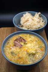 Pea soup, vegetable soup with peas, bacon, and sauerkraut.
