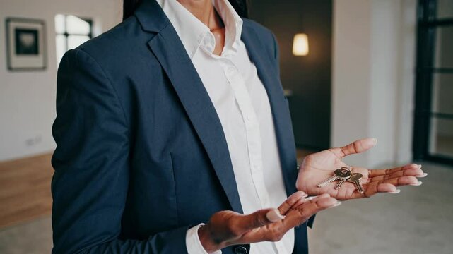 Real estate agent shares keys to a new home in a modern office setting