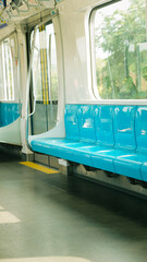 Empty Modern Metro Train Interior with Blue Seats