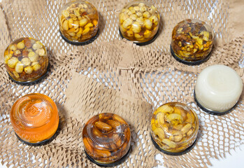 Photo of nuts with honey in jars