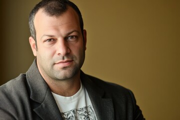 Obraz premium Portrait of a Confident Middle-Aged Man in a Blazer