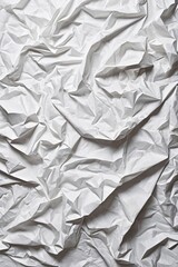 Obraz premium wrinkled white paper with a black background