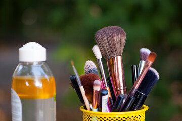 set for cosmetic brushes in the basket. Blush for eyeshadow and various makeup brushes in the shopping cart. Beauty concept, online shopping of decorative cosmetics, discounts in stores