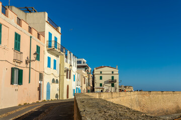 View of the walled city and the promenade on the ramparts of Alghero, Sardinia island, Italy