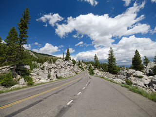 Empty highway pass through a boulder field in Yellowstone © Jorge Moro