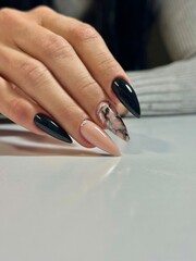 Elegant stiletto nail design on a woman's hand