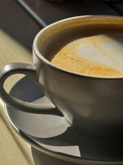 A cup of coffee with foam