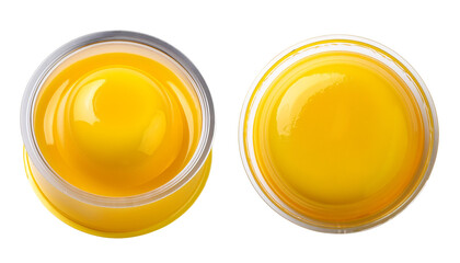 Close-up view of delicious yellow mustard in clear jar, perfect for culinary use.