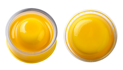 Close-up view of delicious yellow mustard in clear jar, perfect for culinary use.