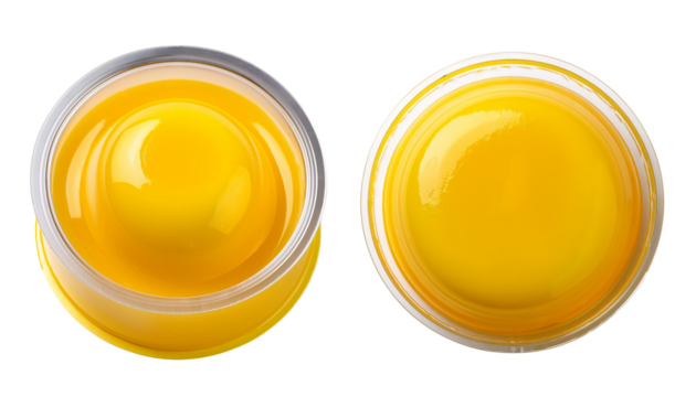 Close-up view of delicious yellow mustard in clear jar, perfect for culinary use.