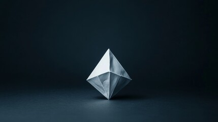 White geometric shape on dark background.