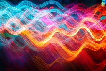Obraz premium Vibrant Abstract Light Trails in Motion Creating Colorful Wave Patterns