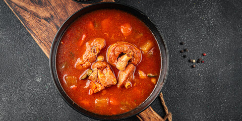 Tomato meat soup vegetable goulash fresh tasty food dish delicious gourmet food background on the table rustic food top view copy space keto and paleo diet