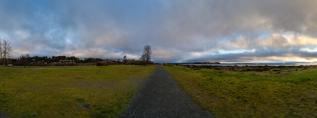Scenic Coastal Pathway Under a Moody Sky on Vancouver Island