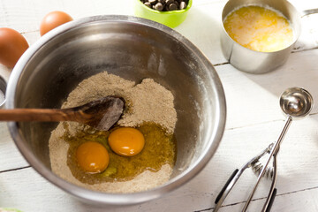 makine chocolate chip cookies, with white background