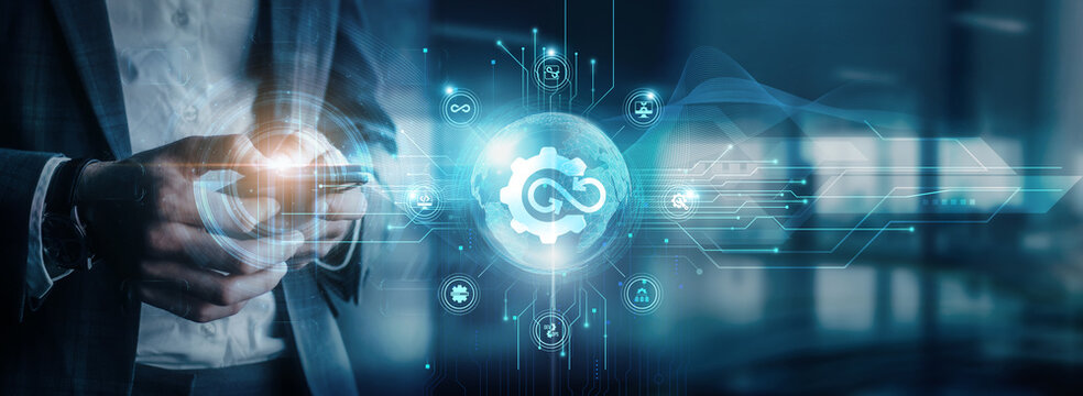 Businessman using mobile devices to interact with DevOps collaboration tools, global network connectivity, and continuous integration systems. collaboration platforms, continuous integration.