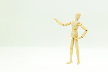 Wooden man on white background shows space for copy and text