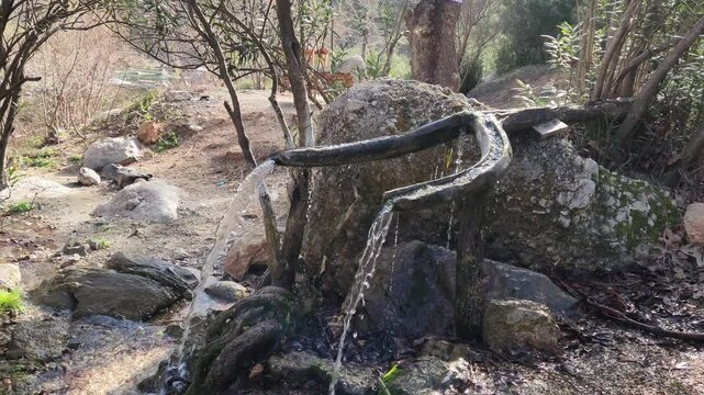Water fountain troughs, carved from a tree trunk, used for drinking water in the Dokuzoluk Recreation Area of the Taurus Mountains.