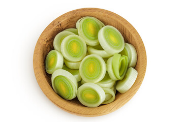 sliced Leek vegetable in wooden bowl isolated on white background. Top view. Flat lay
