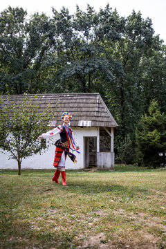 Woman in traditional costume dancing. Ukrainian woman. A young woman in a national Ukrainian costume. Embroidery. Ukrainian national clothing.