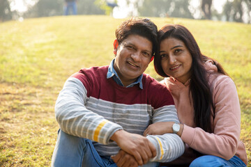 Fototapeta premium Indian young romantic couple hugging at outdoor. Lovely couple embracing each other at park