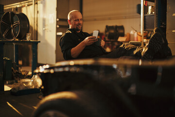 Factory worker taking a coffee break in workshop