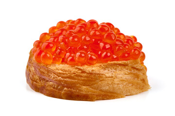 Red caviar on a crispy bread slice, isolated on white background.