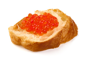 Red caviar on a crispy bread slice, isolated on white background.