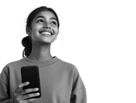 Cheerful Latin teenage girl beaming with joy as she holds her phone, capturing a moment of happiness.