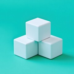 Fototapeta premium White Cubes Stacked on Teal Background