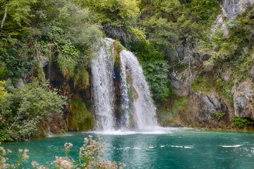 Fototapeta premium Scenic view of hidden waterfall in magical Plitvice lakes National Park, Karlovac, Croatia, Europe.