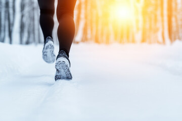 A person is running in the snow with their feet in the snow