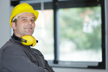 construction worker is looking at camera