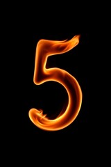 Naklejka premium a close up of a fire number five on a black background