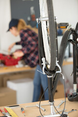 an upside-down bicycle on workbench