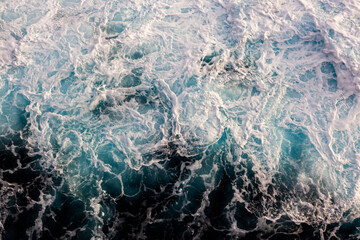 Water surface background. Aerial view of elegant foamy water. Can be used in covers, packaging, posters, textures, presentations, art and design projects. Vibrant nature background image.