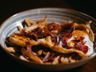 Fries with egg and ham